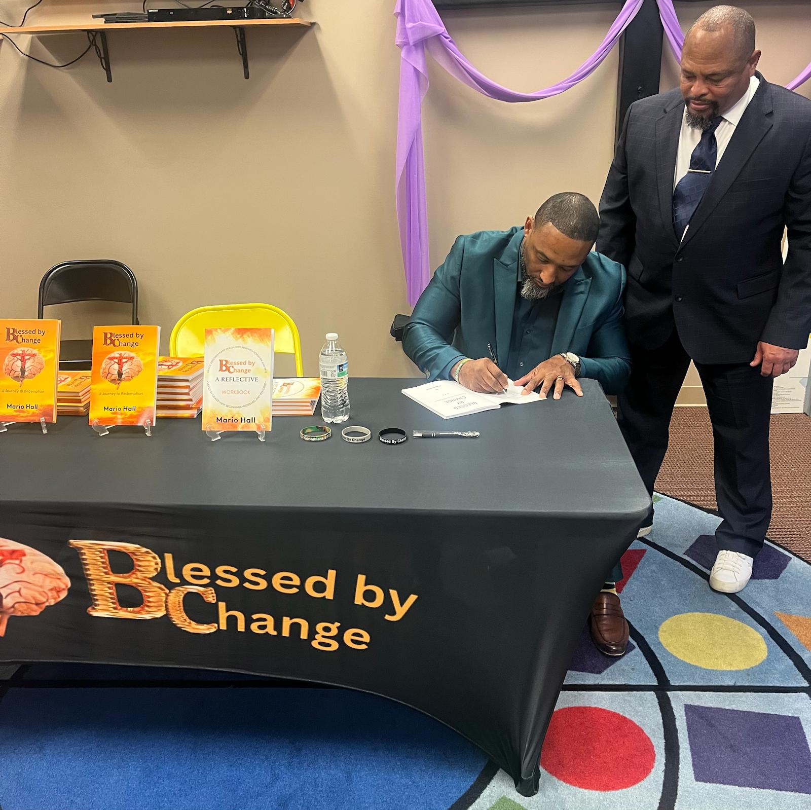 Mario Hall at book signing event